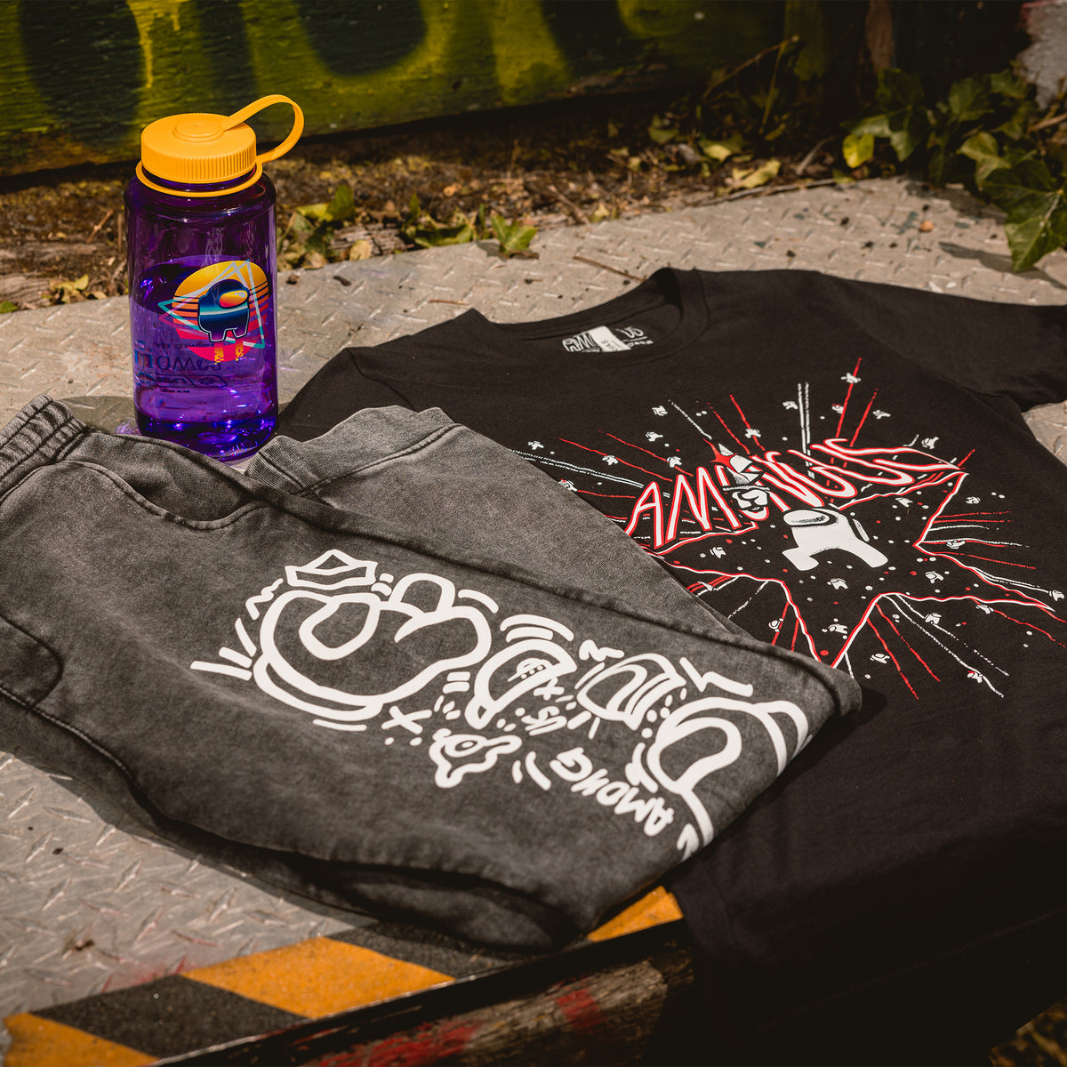 The Crewmate water bottle beside the Among Us 5th Anniversary T-Shirt and Crewmate Joggers.