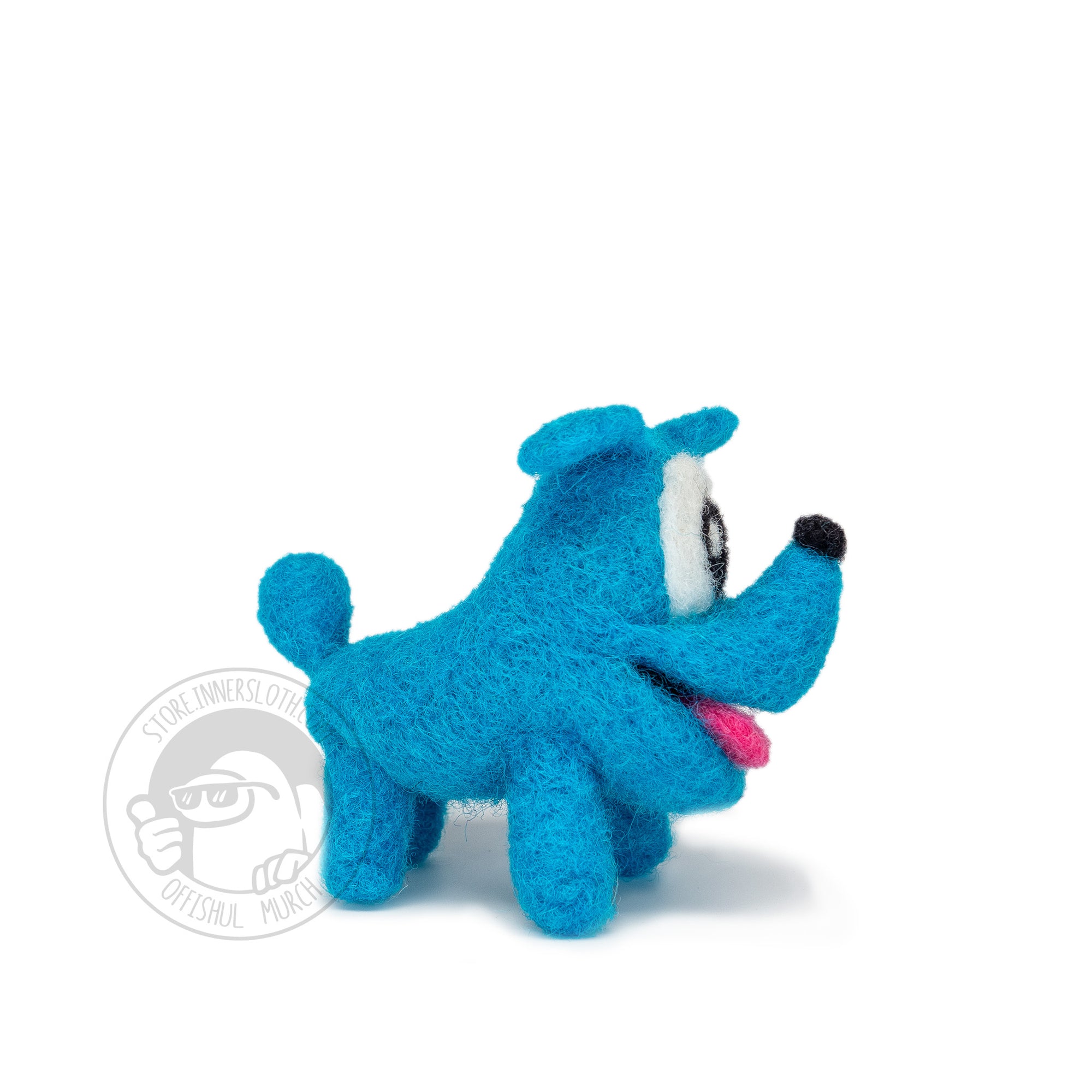 A photograph of the Needle Felted Mini Space Dog by Amarte Studio standing in a ¾ view looking left on a white background. 
