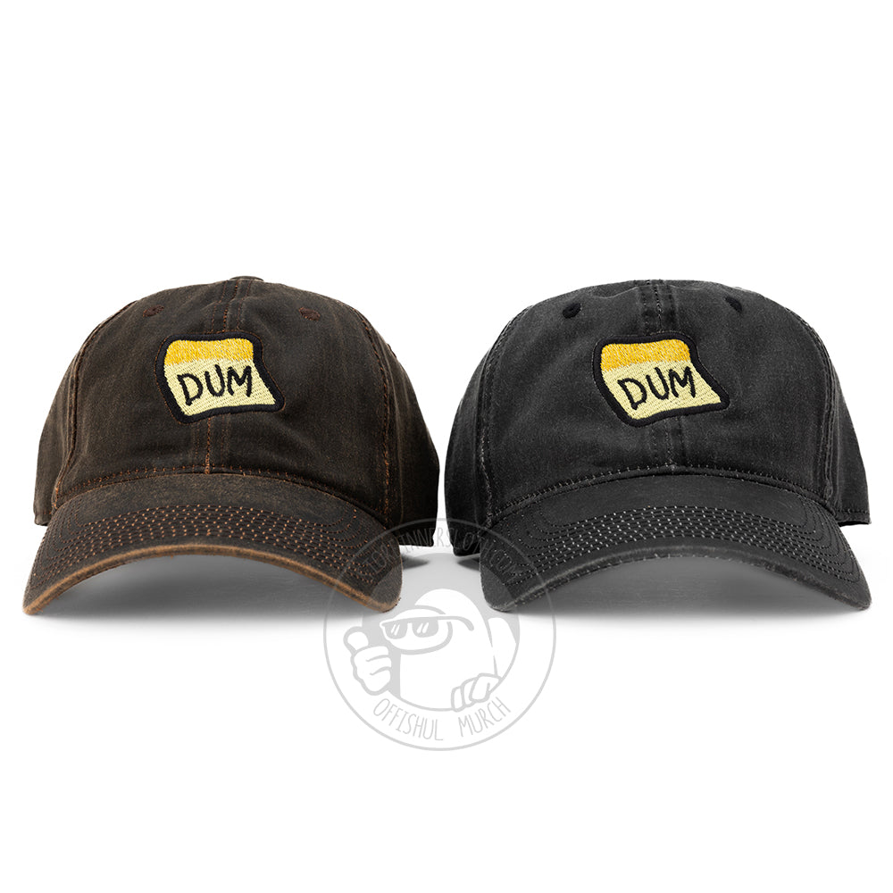 A photograph of the Black &amp; Brown DUM baseball hats sitting side by side. 