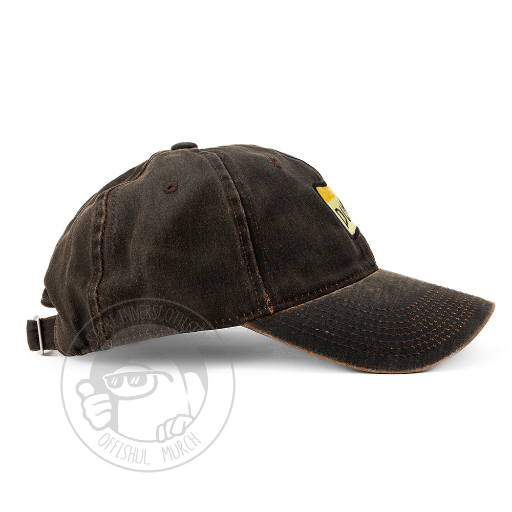 Profile photo of the brown DUM hat from the side.