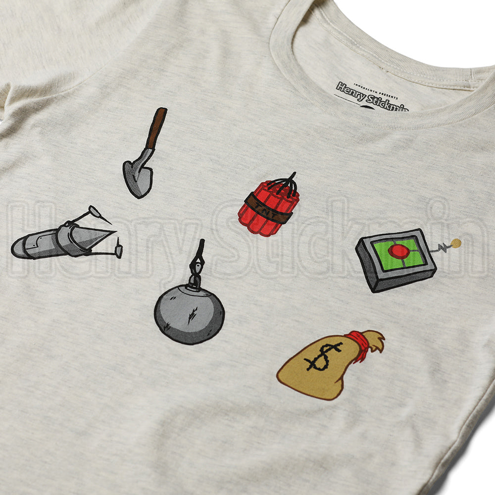 A flat lay photograph of an off white beige t-shirt on a white background. There are six screenprinted details on the front of the shirt, a shovel, a grouping of dynamite sticks, a lazer drill, a metal wrecking ball, a remote control teleporter, and a bag of money with a dollar sign on the front. Designed by PuffballsUnited.