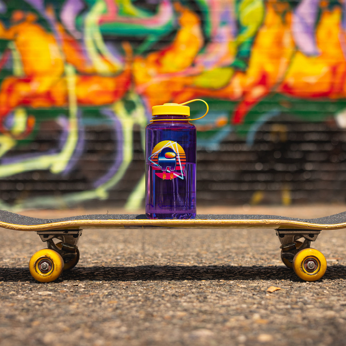 The Crewmate water bottle sitting on a skateboard.