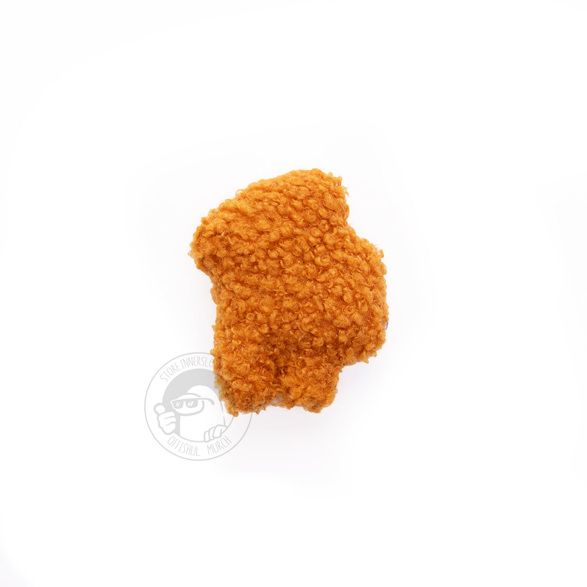 A photograph of the chicken nugget Crewmate plush facing left on a white background. 