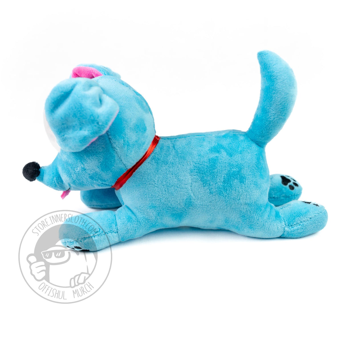  A side view of the Doggy plush lying on its belly against a white background. The collar is more prominently seen in this image.