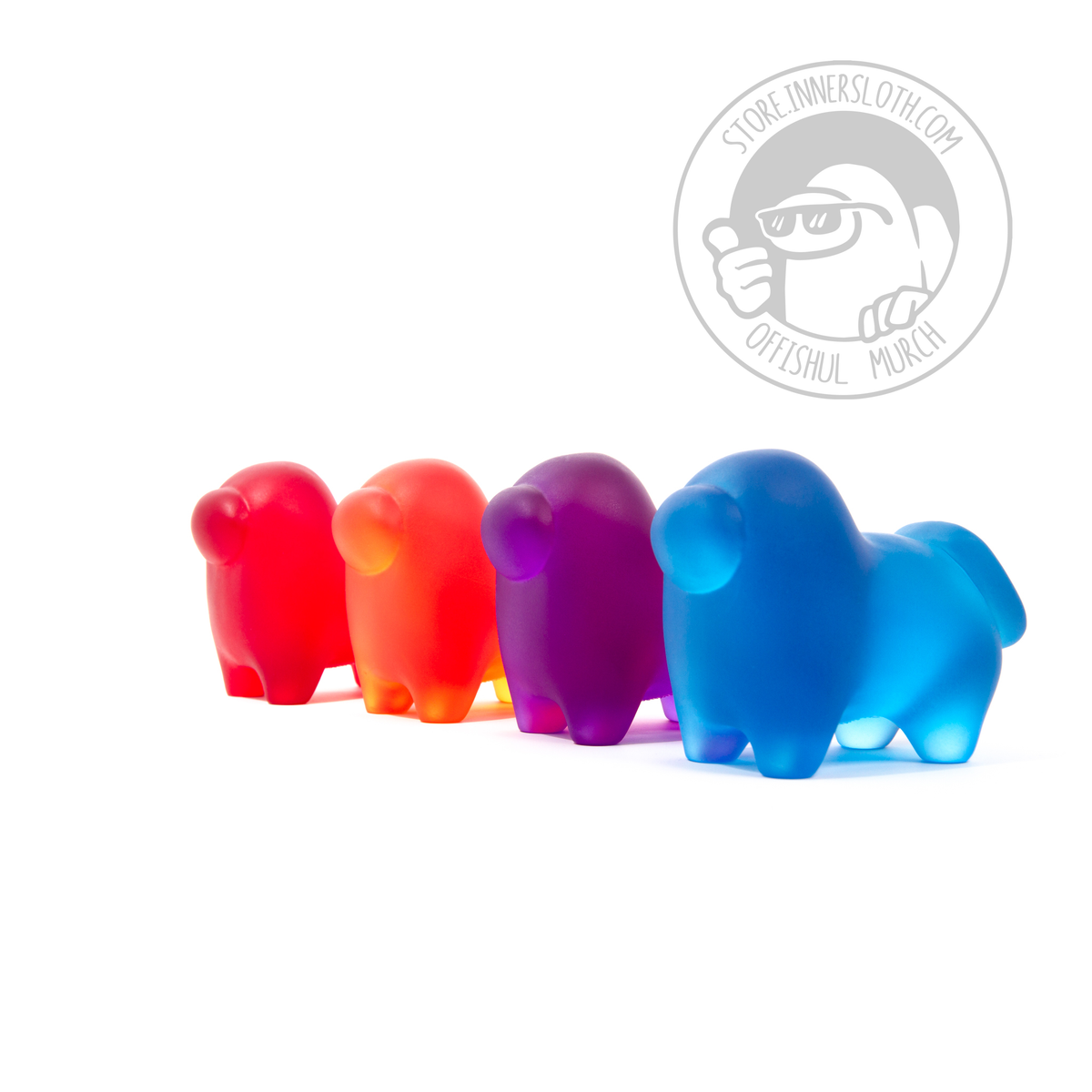 A photograph of all four translucent Crewgi Figurines on a white background. They are standing side-by-side in a diagonal 3/4 profile view standing shoulder to shoulder. The order of Crewgis left to right is red, orange, purple, blue.  
