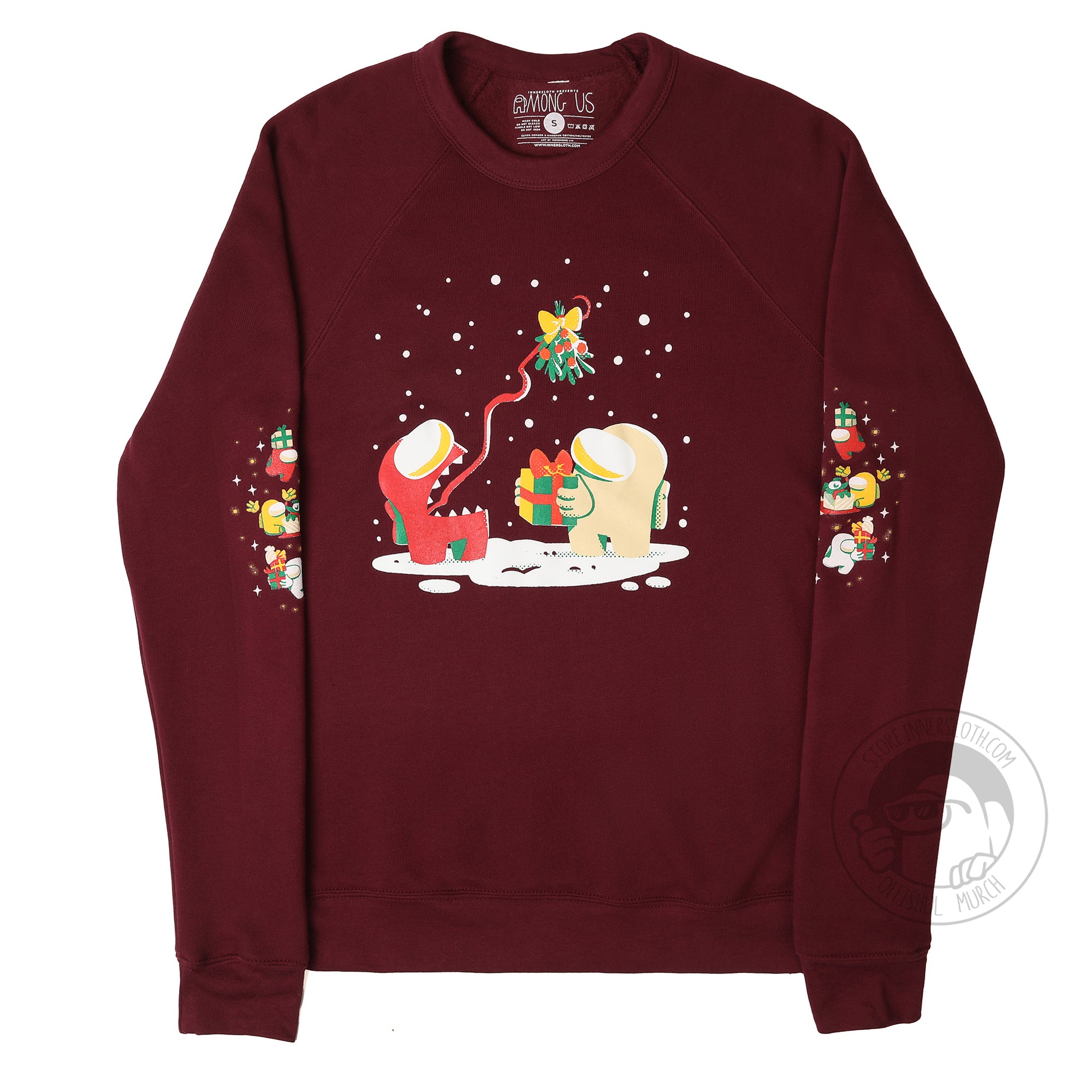 A flat lay photograph of a maroon longsleeve sweatshirt on a white background. The front of the garment features an illustration of an Impostor and Crewmate under the Mistletoe and two mirrored holiday sleeve designs. Artwork designed by Mengmeng Liu