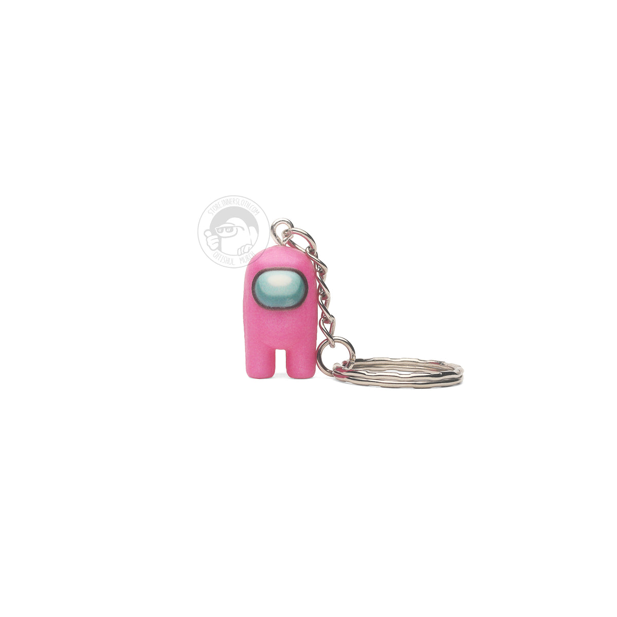 A product photo of the Among Us: Crewmate Keychain by Objex Unlimited Inc. in pink. It is standing, and a silver keychain rests beside it.