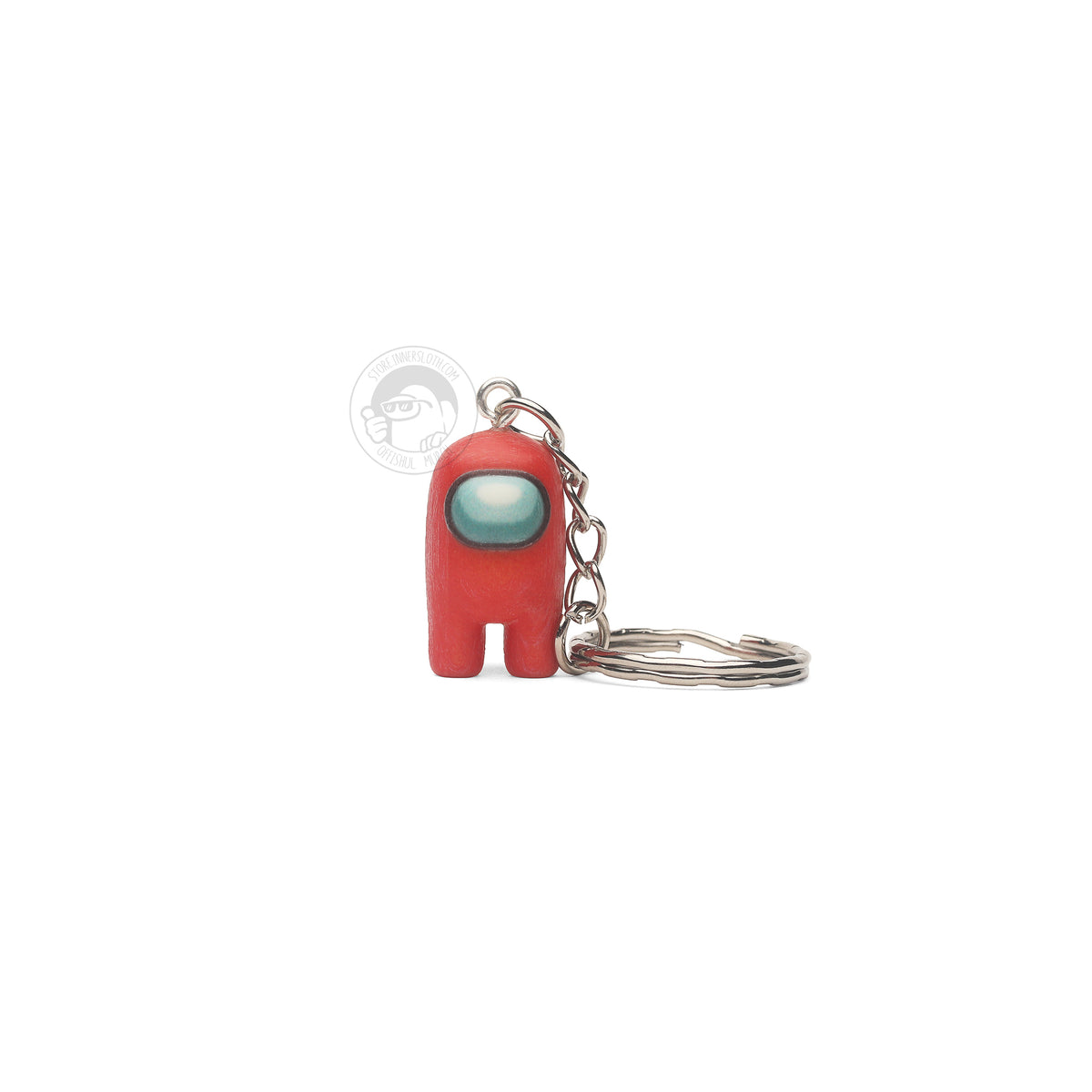 A product photo of the Among Us: Crewmate Keychain by Objex Unlimited Inc. in red. It is standing, and a silver keychain rests beside it.