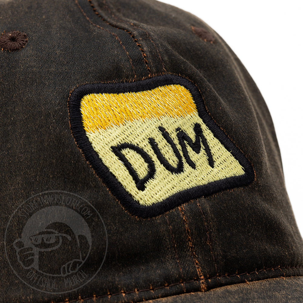 Zoomed in photo of the brown DUM hat to show embroidery detail