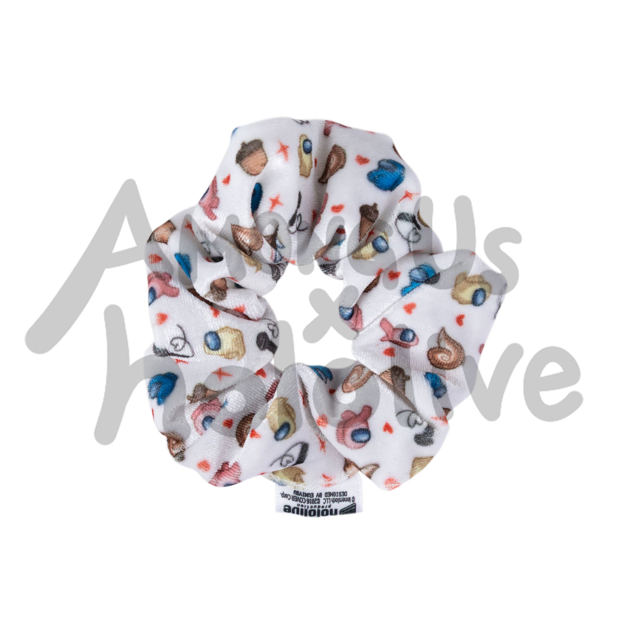 A product photo of a white scrunchie with small printed designs. The pattern shows rose, banana, and blue crewmates among acorns, snakes, small red hears, and red impostor shines.