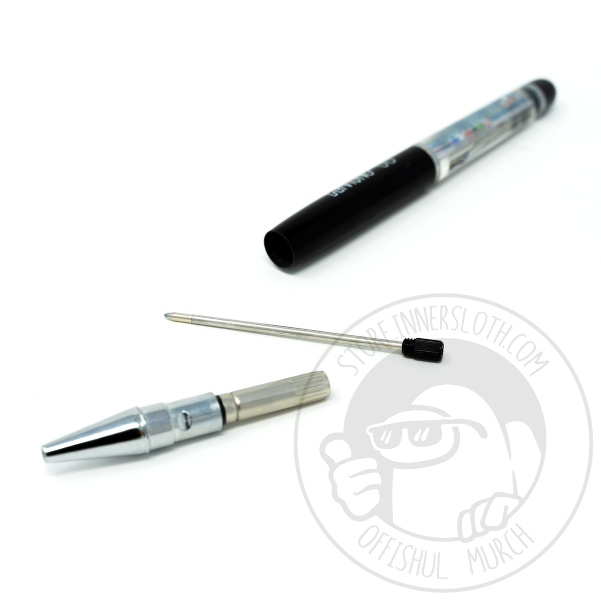 A disassembled view of the pen. The Pen is broken up into three pieces. The tip and ink barrel, the metal nib, and the plastic tubing.