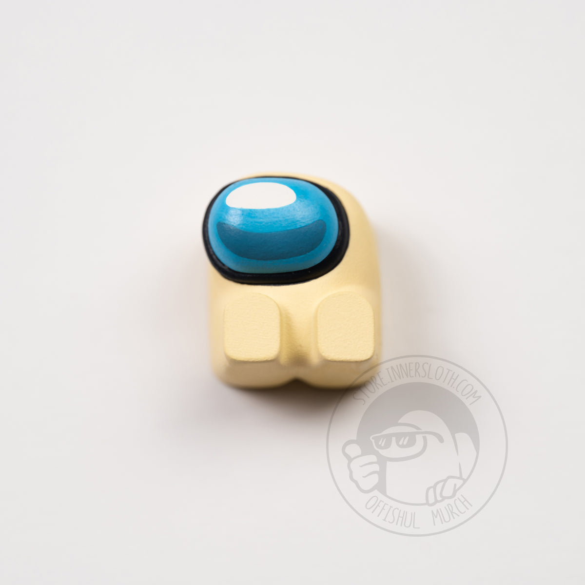 A product photo from above of the banana keyboard keycap.