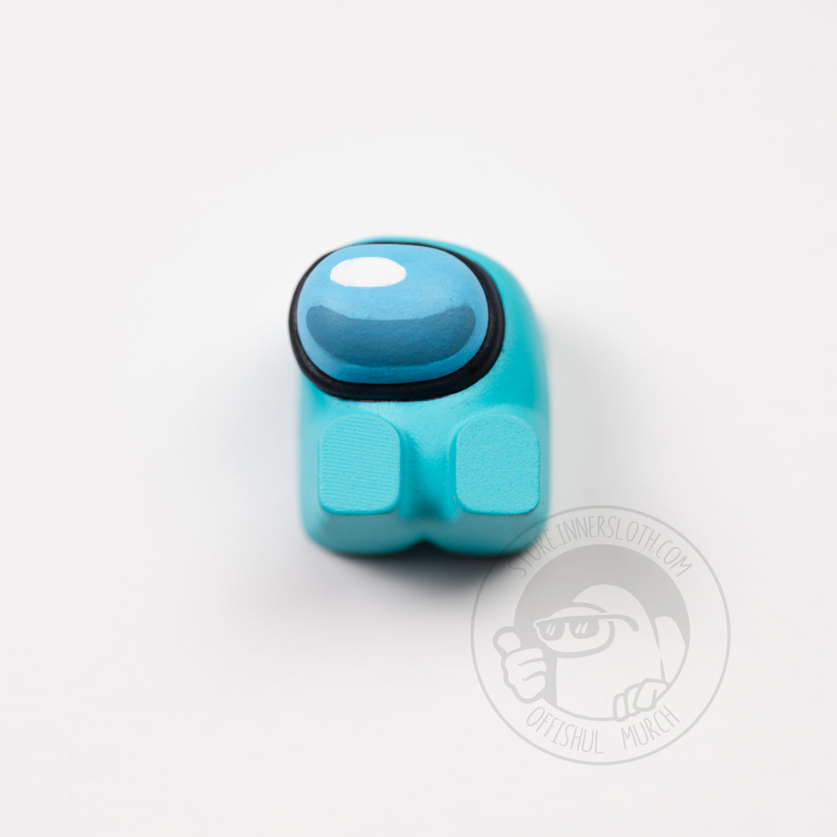 A product photo from above of the cyan keyboard keycap.