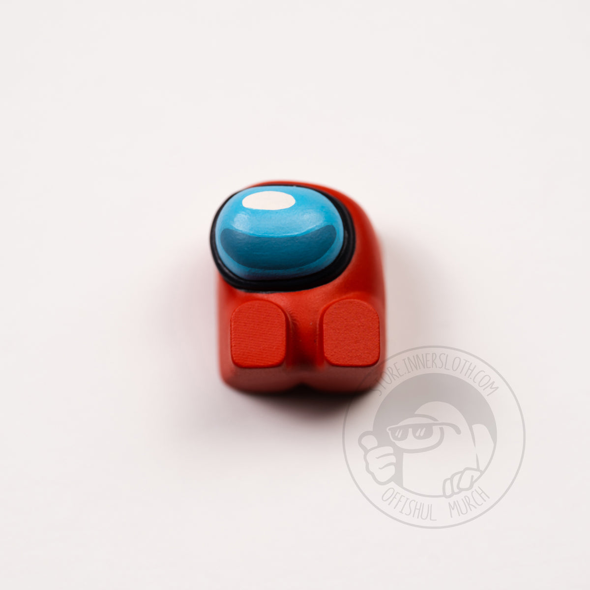 A product photo from above of the red keyboard keycap.