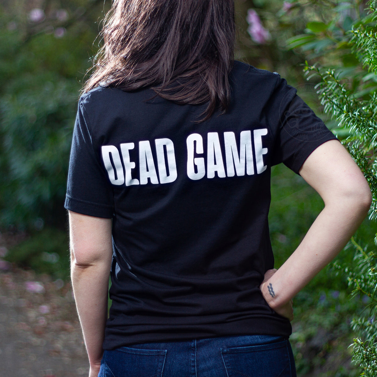 A model wearing the Dead Game Redux T-Shirt from the back. 