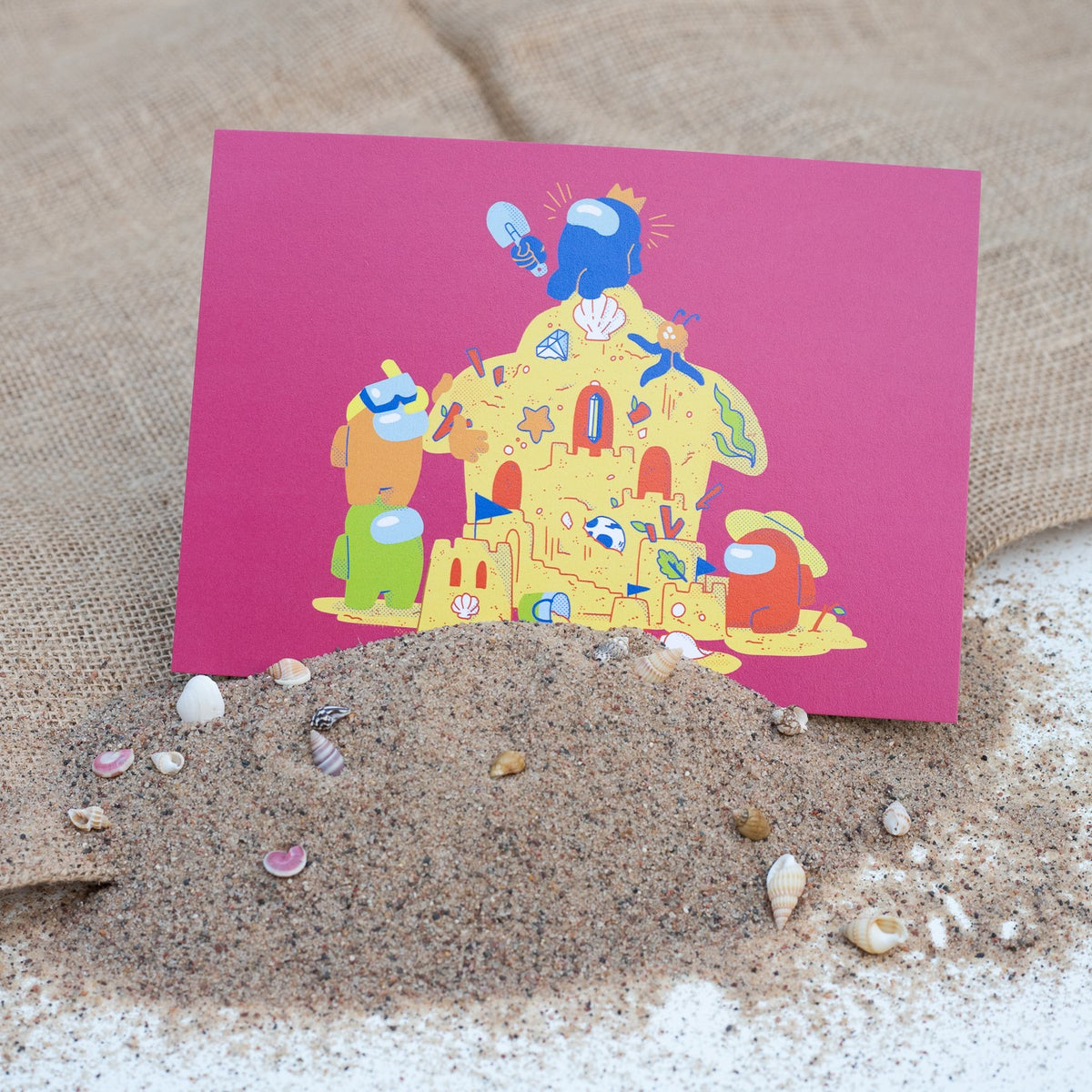 A photo of the sandcastle print sticking up in the sand.