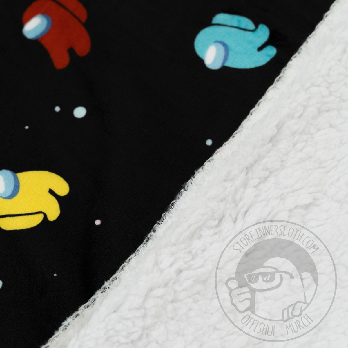 An angled split close-up shot showing the inner Sherpa lining and outside Crewmate &quot;Space Party&quot; Pattern.