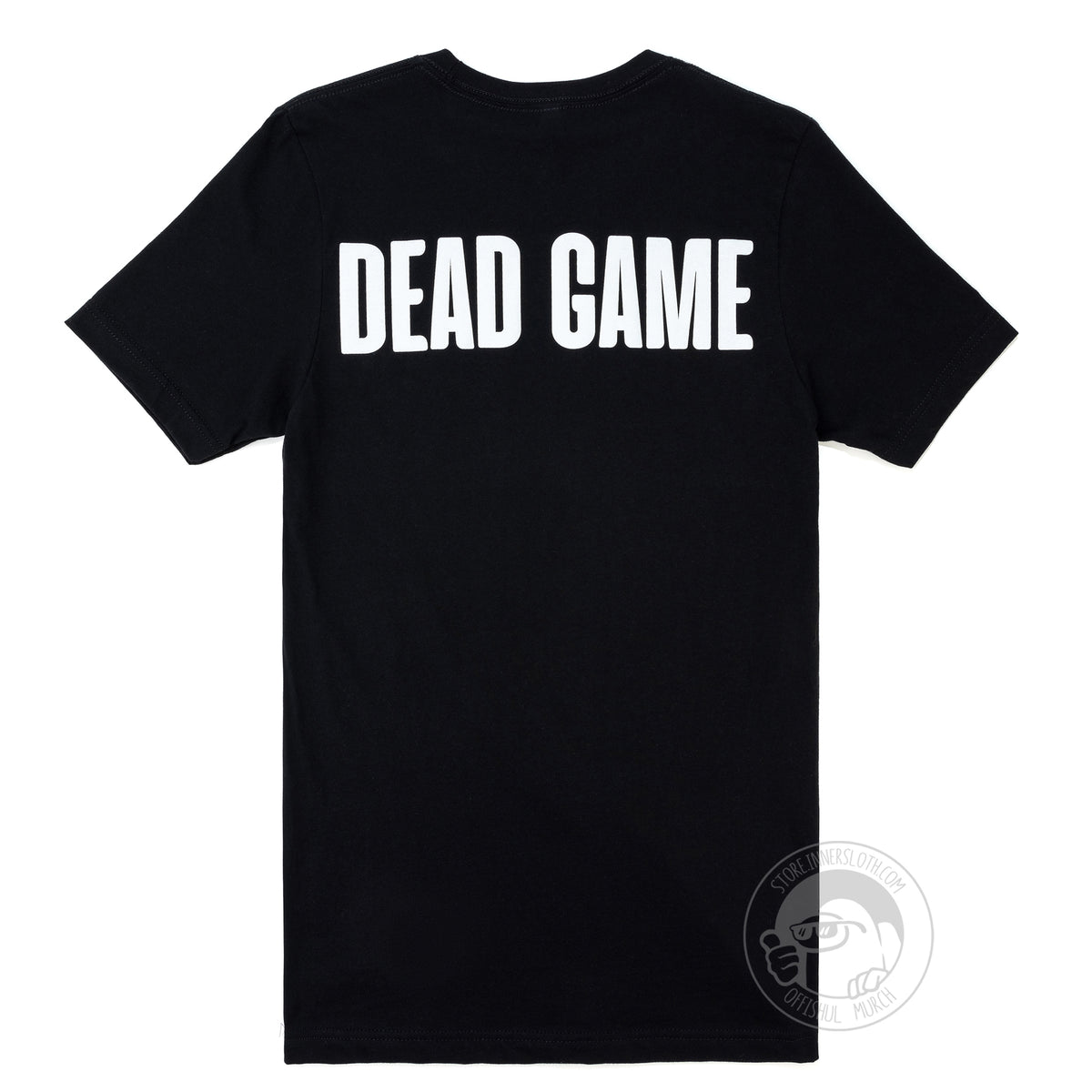 A flat lay photograph of the back of a black t-shirt. The words “DEAD GAME” are printed across the top back in white caps.