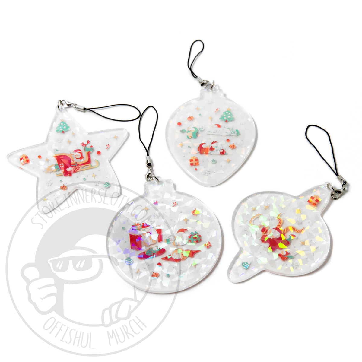 A photograph of four clear acrylic ornaments on a white background. Each ornament has its own shape and special holiday Crewmate illustration, each design is overlaid with iridescent sparkles. The ornaments are attached to a removable lobster clasp strap and jump ring. Designed by Mengmeng Liu.